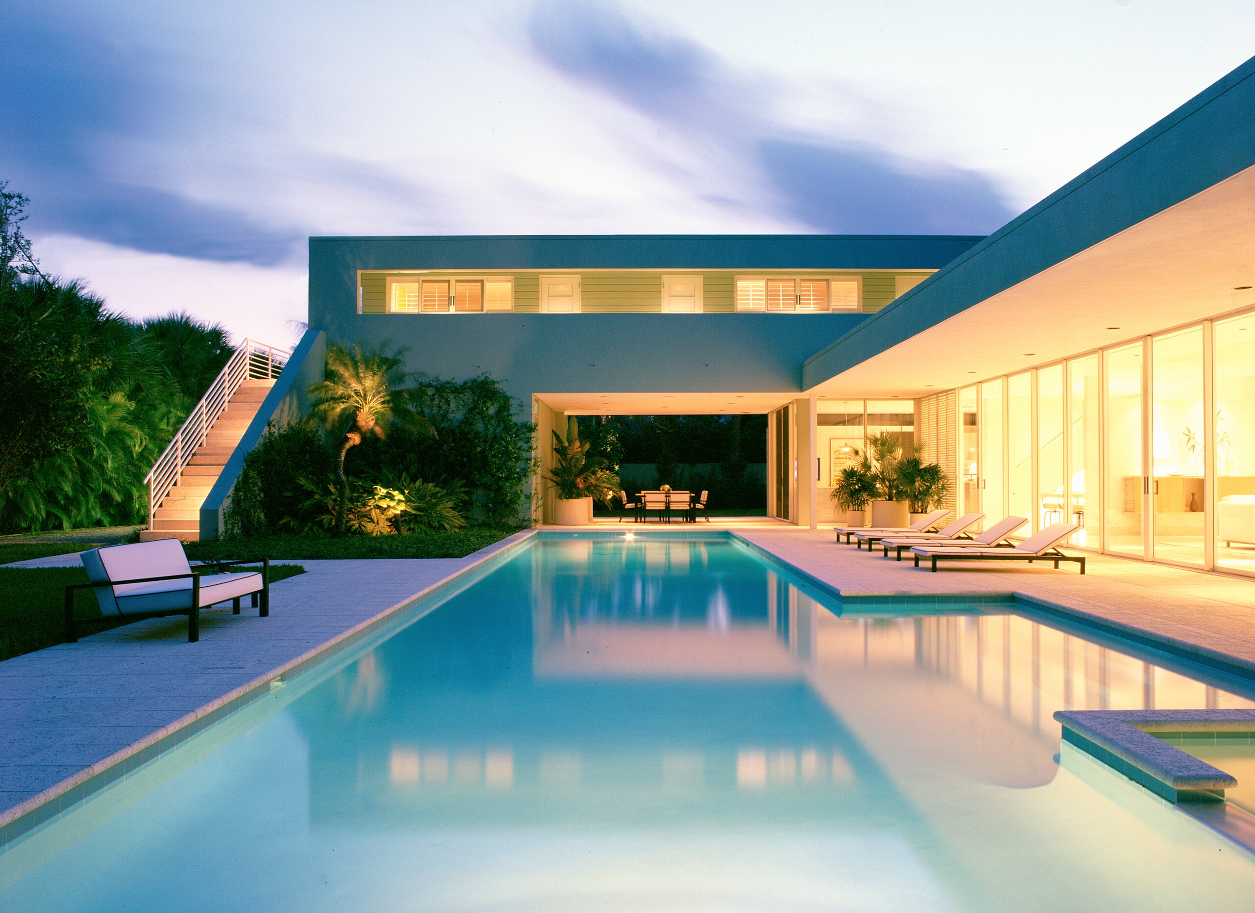 Gomez Road residence and pool at dusk